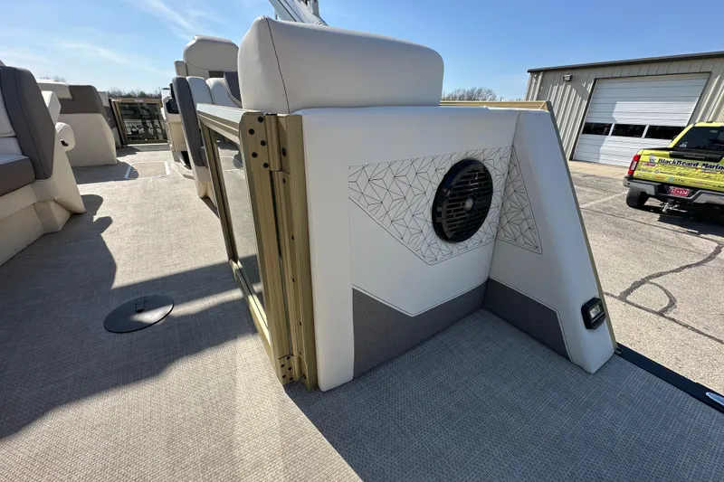 Slide: The Image of Interior of 2026 Alera M23Q boat with modern seating and speaker system. - 10