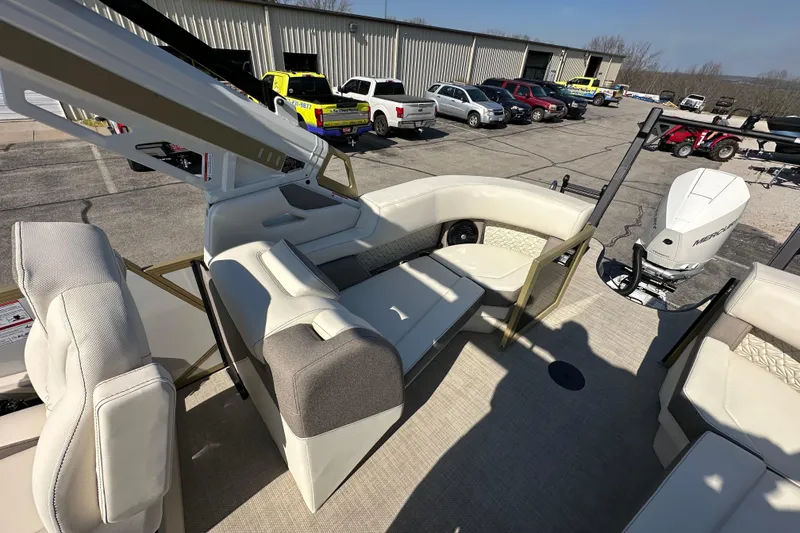 Slide: The Image of Luxurious Alera M23Q boat interior with seating, 2026 model, parked near vehicles. - 14