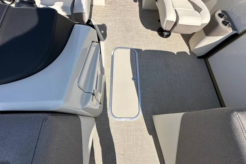 Slide: The Image of Interior of 2026 Alera M23Q boat with seating and storage compartment. - 16