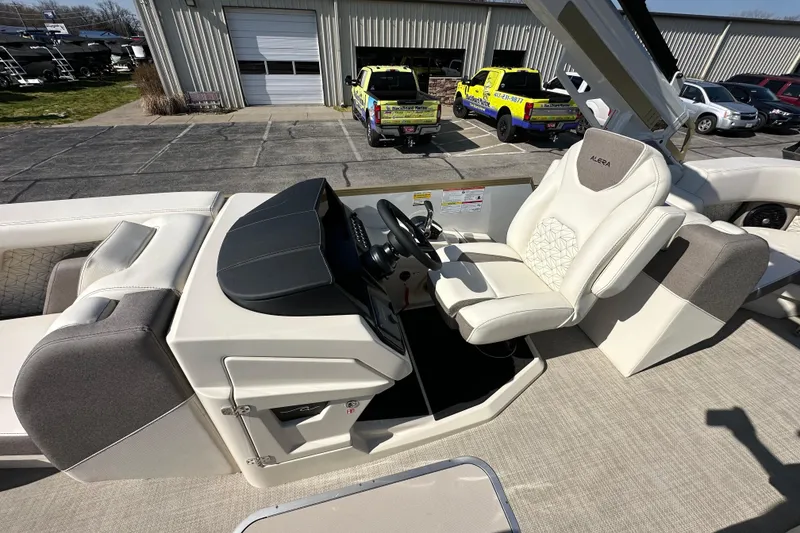 Slide: The Image of Alera M23Q 2026 boat interior with white captain's chair and control panel. - 18