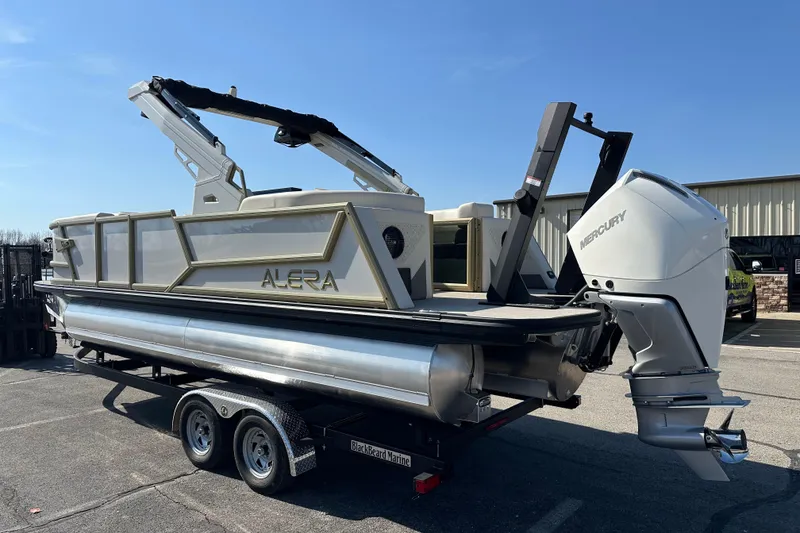 Slide: The Image of Alera M23Q 2026 pontoon boat with Mercury outboard engine on trailer. - 3