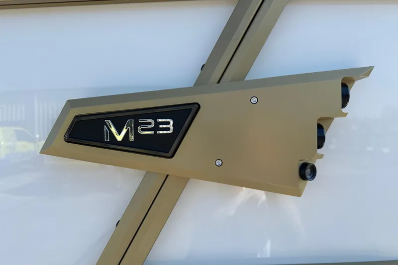 Slide: The Image of Alera M23Q 2026 model emblem on a sleek metallic surface. - 6