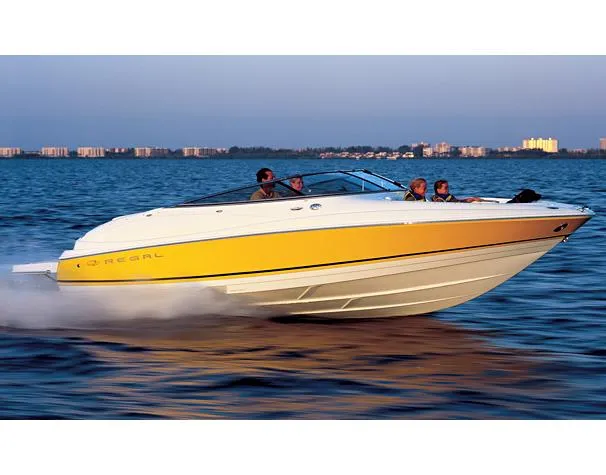 The Image of 2005 Regal 2400 Bowrider boat on water, sunny day, blue sky, ladder attached. - 0