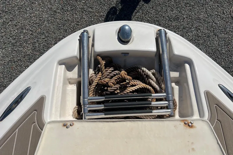 Slide: The Image of Bow of 2005 Regal 2400 Bowrider with rope and ladder storage. - 33
