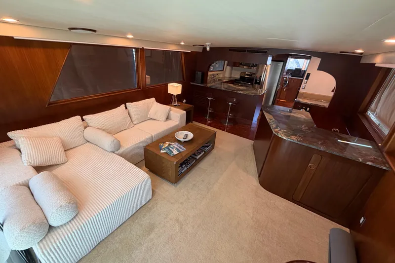 Slide: The Image of Luxurious interior of 1991 Hatteras 70 Motor Yacht with elegant wood finishes and modern furnishings. - 55