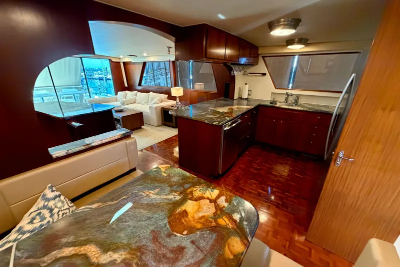 Slide: The Image of Interior of 1991 Hatteras 70 Motor Yacht with elegant wood finishes and modern kitchen. - 64