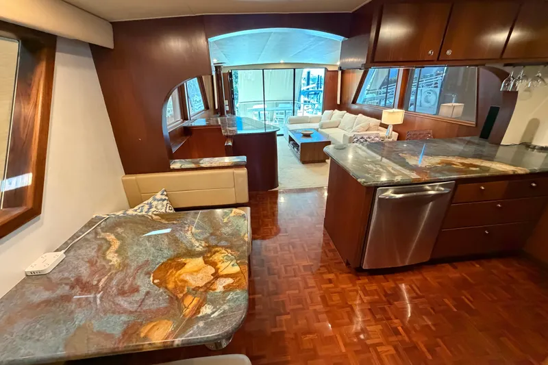 Slide: The Image of Kitchen area of a 1991 Hatteras 70 Motor Yacht with modern appliances. - 67