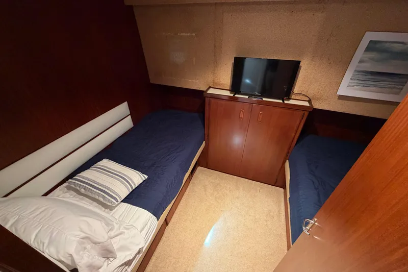 Slide: The Image of Luxurious bathroom in 1991 Hatteras 70 Motor Yacht with modern fixtures and elegant design. - 82