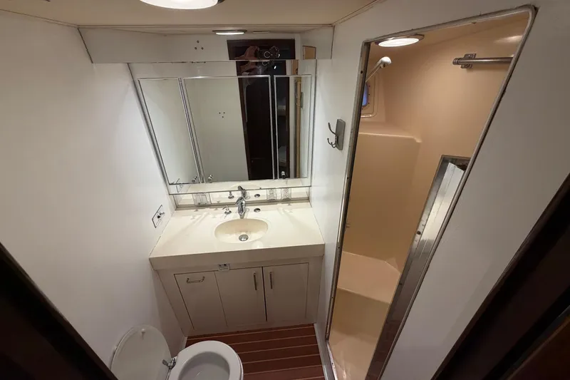Slide: The Image of Bathroom interior of 1991 Hatteras 70 Motor Yacht with sink and shower. - 93