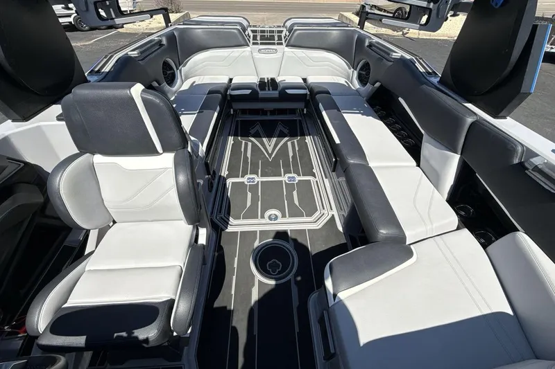 Slide: The Image of 2023 Supra SE 550 boat interior with sleek seating and modern design. - 12
