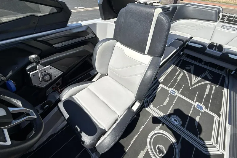 Slide: The Image of 2023 Supra SE 550 boat interior with modern seating and control panel. - 13