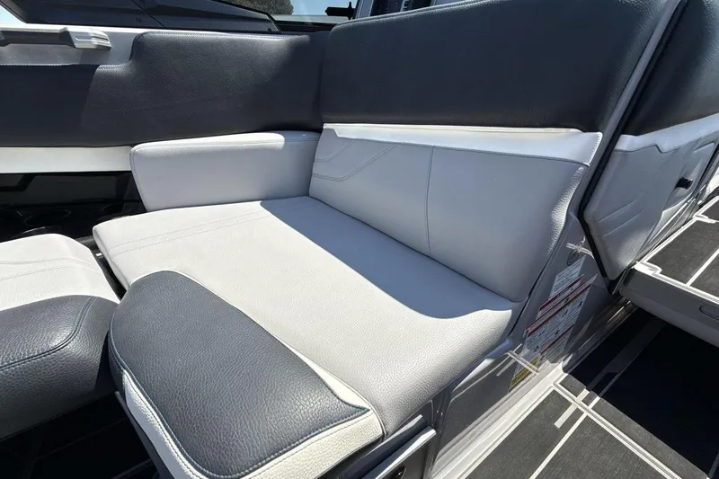 Slide: The Image of 2023 Supra SE 550 boat interior with sleek, modern seating design. - 17