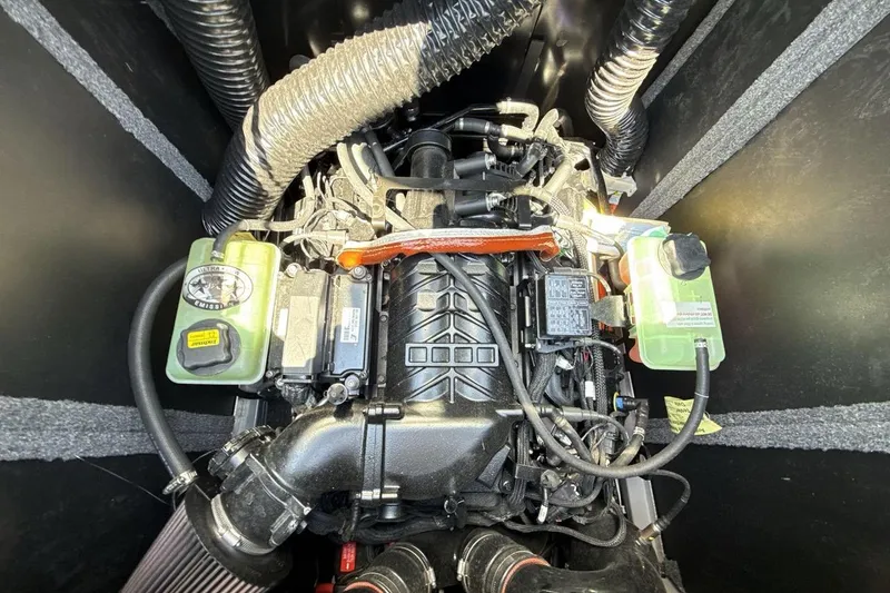 Slide: The Image of 2023 Supra SE 550 engine compartment with detailed components and wiring. - 20