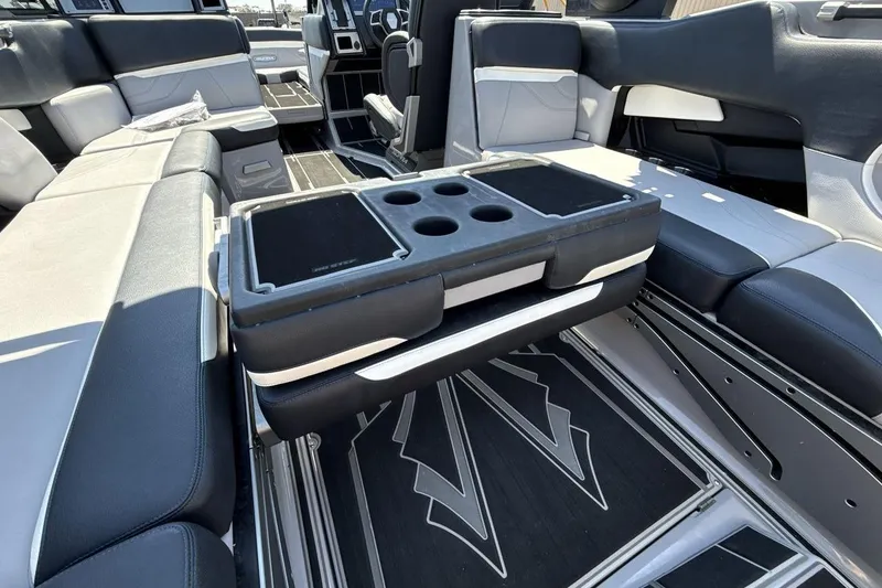 Slide: The Image of Interior of 2023 Supra SE 550 boat with luxurious seating and cup holders. - 23