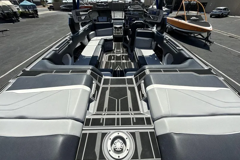 Slide: The Image of 2023 Supra SE 550 boat interior with sleek seating and modern design. - 9