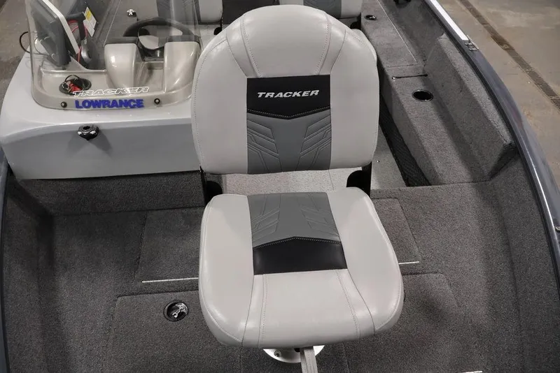 Slide: The Image of 2019 Tracker Pro Guide V-16 SC boat interior with gray seating and Lowrance equipment. - 12