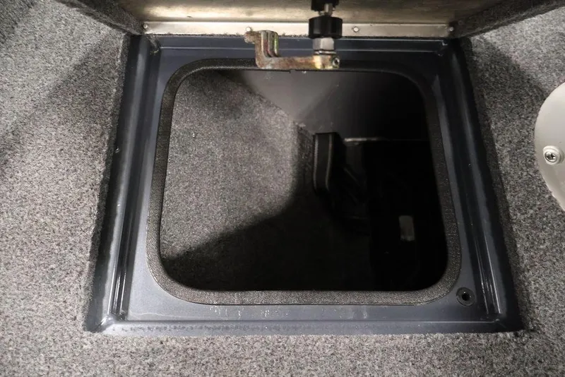 Slide: The Image of Open storage compartment in 2019 Tracker Pro Guide V-16 SC boat. - 13