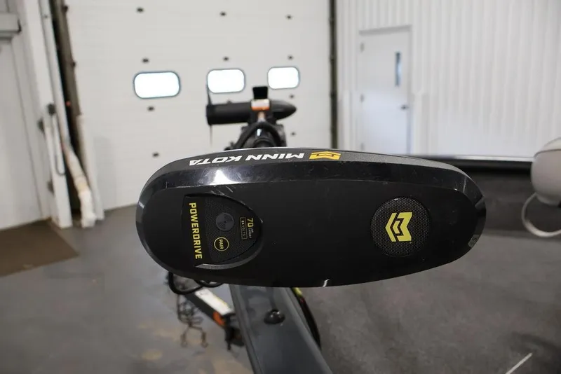 Slide: The Image of Minn Kota PowerDrive motor on 2019 Tracker Pro Guide V-16 SC boat in garage. - 16