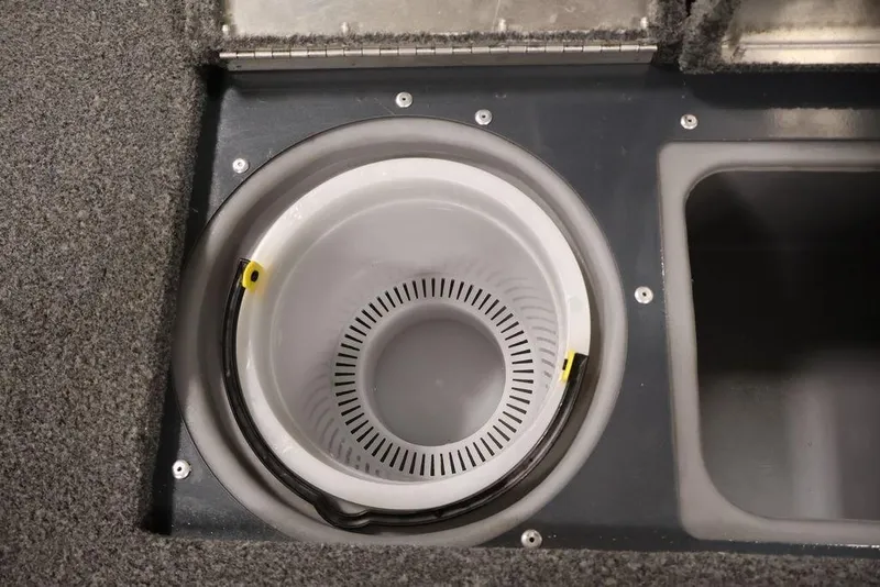 Slide: The Image of 2019 Tracker Pro Guide V-16 SC boat livewell with carpeted interior. - 18