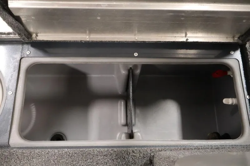 Slide: The Image of 2019 Tracker Pro Guide V-16 SC livewell compartment, open and empty. - 21