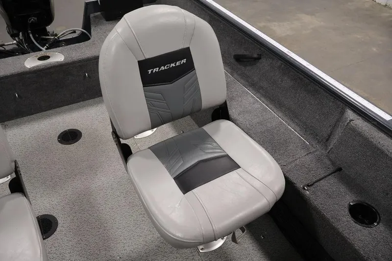Slide: The Image of 2019 Tracker Pro Guide V-16 SC boat seat, gray with black accents, interior view. - 26
