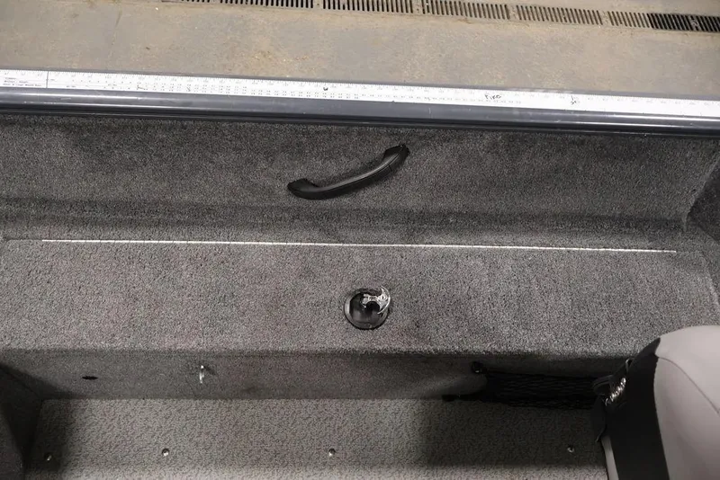 Slide: The Image of Interior of 2019 Tracker Pro Guide V-16 SC boat showing carpeted floor and seating. - 28