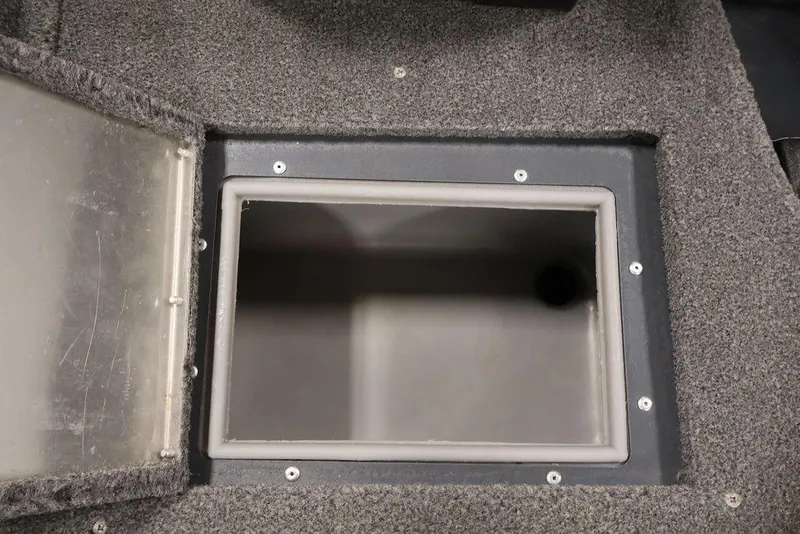 Slide: The Image of 2019 Tracker Pro Guide V-16 SC boat storage compartment with open lid. - 29