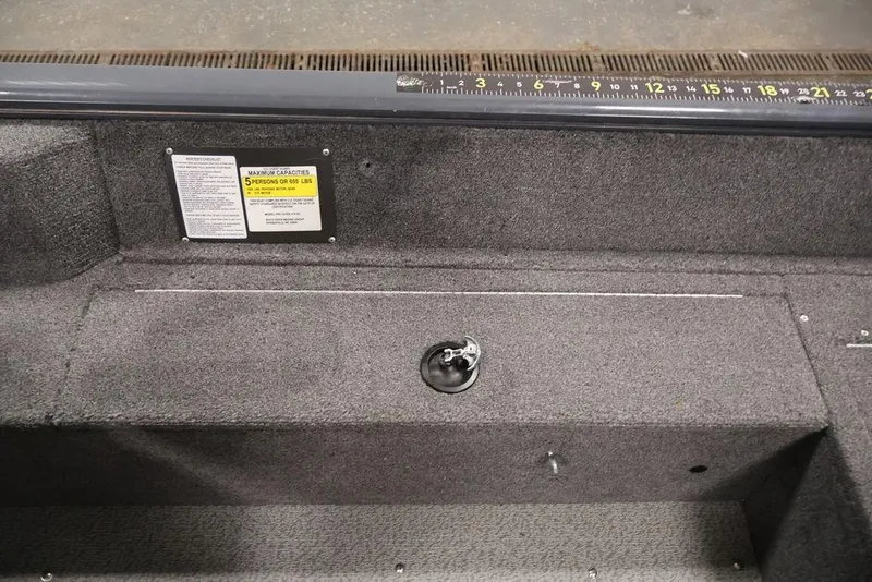 Slide: The Image of 2019 Tracker Pro Guide V-16 SC boat interior with capacity label and measurement ruler. - 31