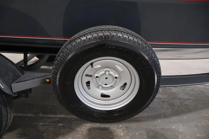 Slide: The Image of Trailer wheel of a 2019 Tracker Pro Guide V-16 SC boat. - 34