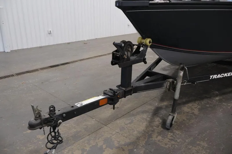 Slide: The Image of 2019 Tracker Pro Guide V-16 SC boat trailer hitch in a garage setting. - 36