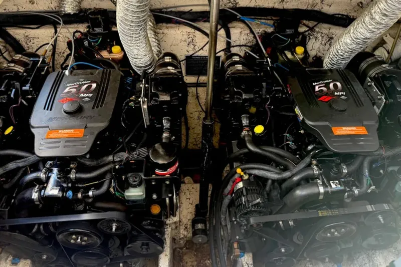 Slide: The Image of Twin MerCruiser 5.0 MPI engines in a 2005 Rinker Fiesta Vee 300 boat. - 15