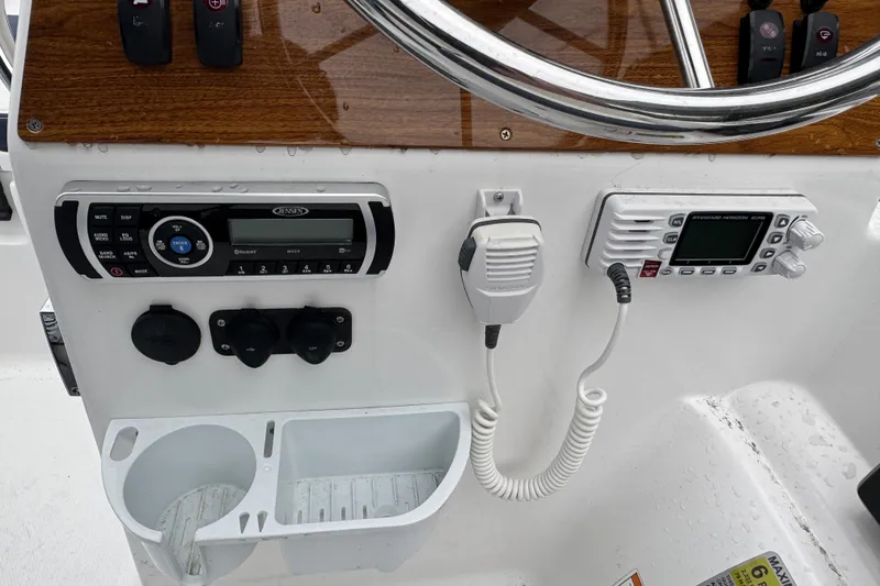 Slide: The Image of 2019 AB Inflatables Nautilus 15 DLX dashboard with radio and control panel. - 10