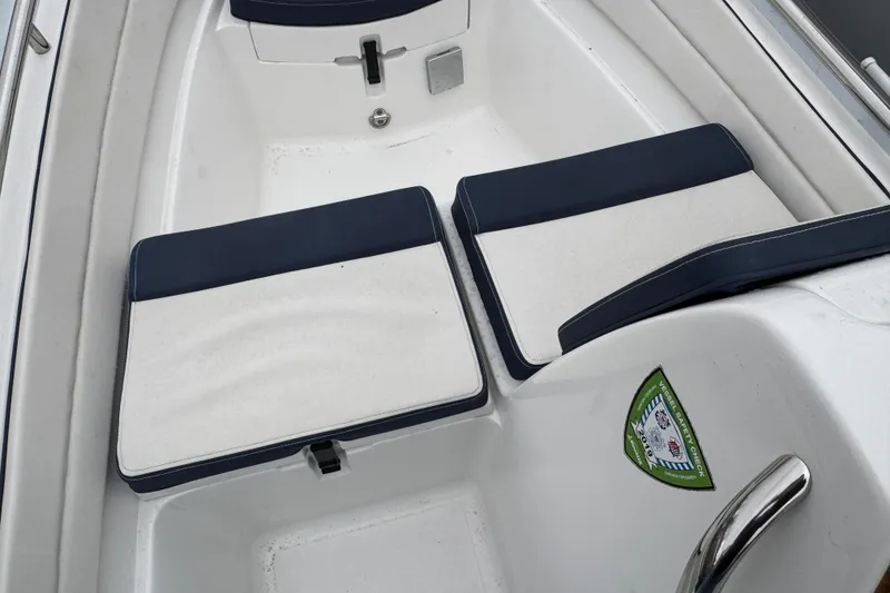 Slide: The Image of 2019 AB Inflatables Nautilus 15 DLX boat interior with cushioned seating and safety sticker. - 11