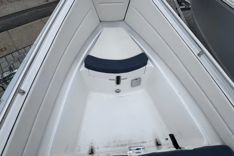 Slide: The Image of 2019 AB Inflatables Nautilus 15 DLX boat interior with white seating and storage compartment. - 12