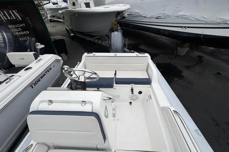 Slide: The Image of 2019 AB Inflatables Nautilus 15 DLX boat interior with steering wheel and seating. - 17