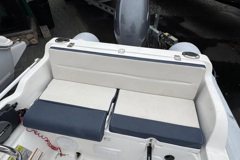 Slide: The Image of 2019 AB Inflatables Nautilus 15 DLX boat interior with cushioned seating and motor. - 5