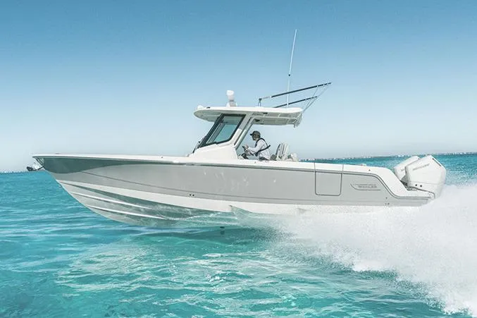 The Image of Manufacturer Provided Image: 2026 Boston Whaler 330 Outrage cruising on clear blue ocean waters. - 0