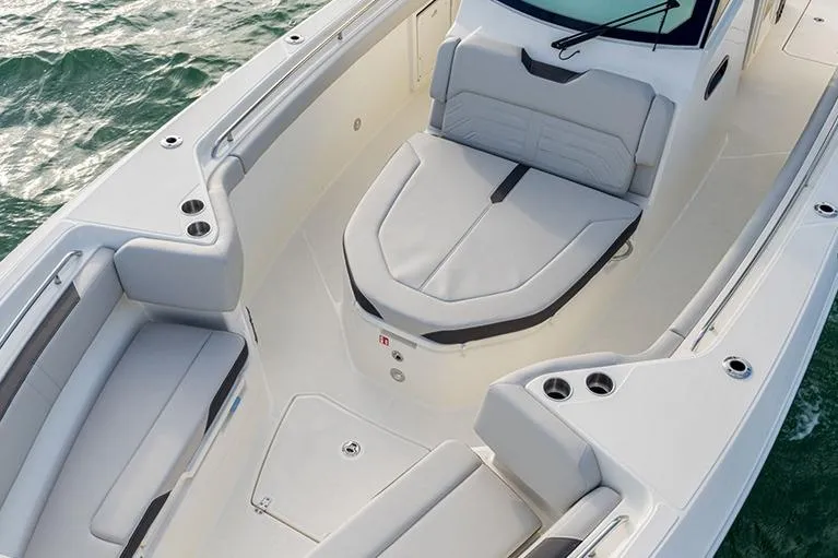 Slide: The Image of Manufacturer Provided Image: 2026 Boston Whaler 330 Outrage boat interior with sleek seating and modern design. - 3
