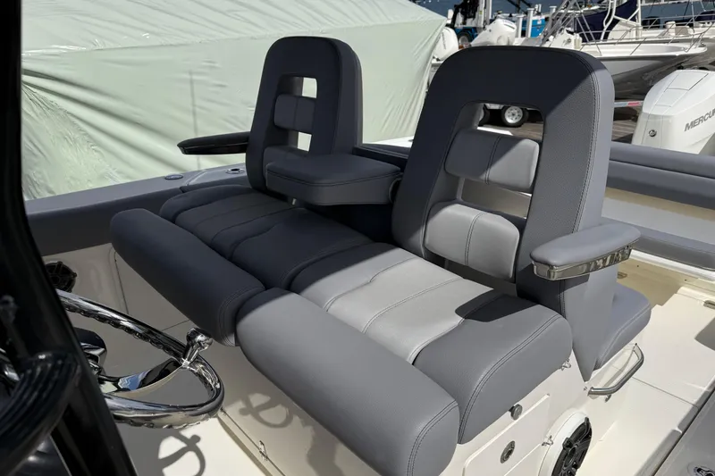 Slide: The Image of 2026 Boston Whaler 330 Outrage boat seats with sleek, modern design and comfortable upholstery. - 8