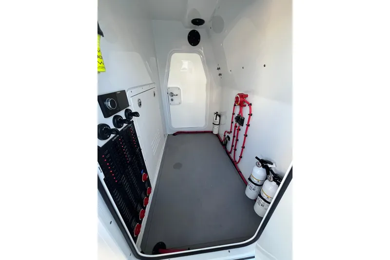 Slide: The Image of Interior of a 2022 Freeman 37VH boat, featuring control panels and safety equipment. - 15