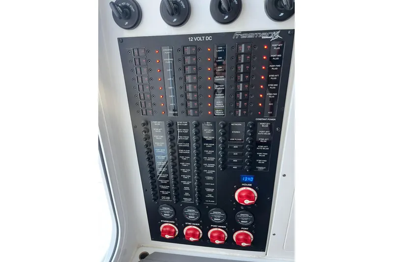 Slide: The Image of Control panel of a 2022 Freeman 37VH boat with switches and indicators. - 16