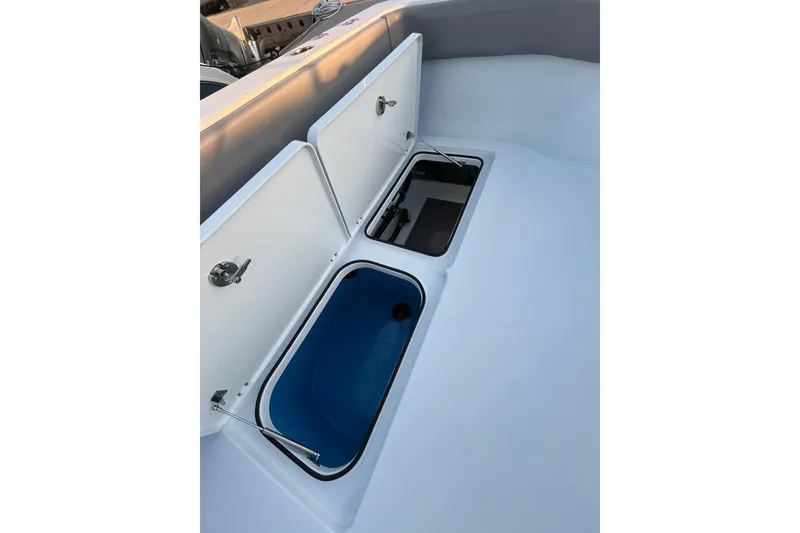 Slide: The Image of Open storage compartments on a 2022 Freeman 37VH boat deck. - 23