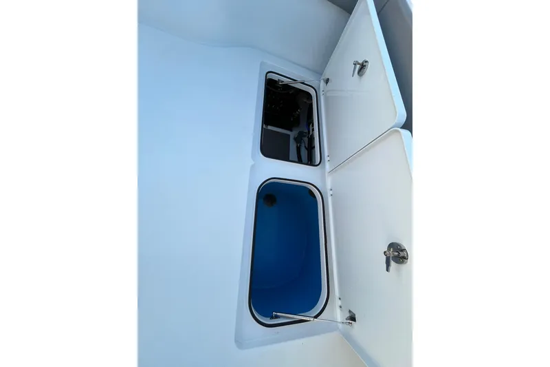 Slide: The Image of Open storage compartments on a 2022 Freeman 37VH boat. - 24