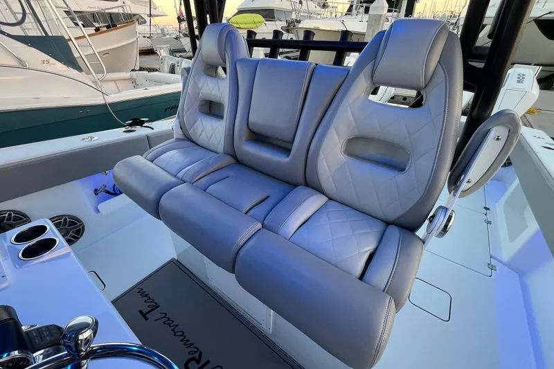 Slide: The Image of Luxury seating on a 2022 Freeman 37VH boat, featuring quilted gray upholstery. - 3