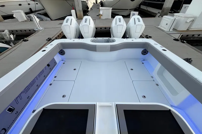 Slide: The Image of Freeman 37VH 2022 boat with quad engines docked, featuring spacious deck and modern design. - 30