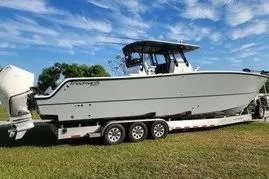 Slide: The Image of 2022 Freeman 37VH boat on trailer under blue sky. - 35