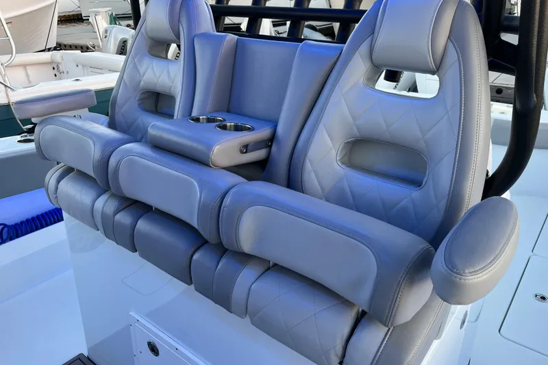 Slide: The Image of Luxurious gray leather seats on a 2022 Freeman 37VH boat, featuring cup holders. - 4