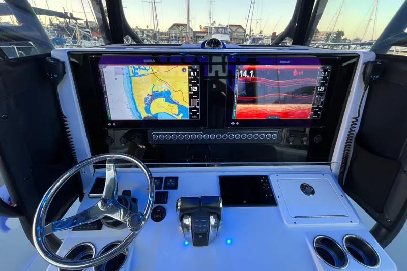 Slide: The Image of Cockpit of 2022 Freeman 37VH boat with dual Simrad displays and steering wheel. - 6