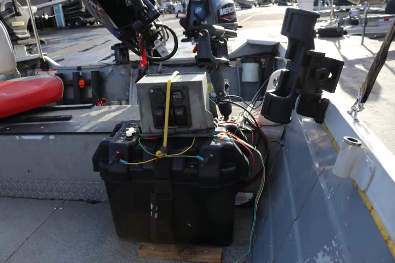 Slide: The Image of 1997 Starcraft Patriot 160 boat interior with battery and wiring setup. - 12