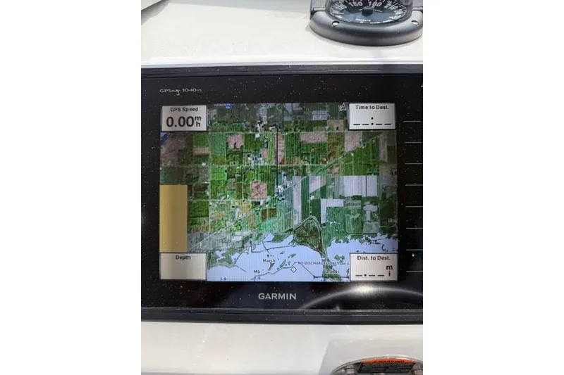 Slide: The Image of Garmin GPS display on 2015 Parker 2520XLD boat, showing map and speed data. - 14